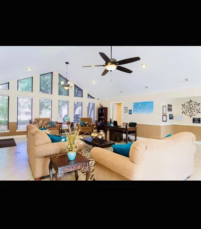 a view of a swimming pool with a patio