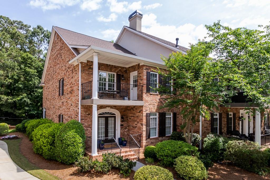 2537 Oglethorpe Circle Northeast Brookhaven, GA 30319 - Photo 1 of 1 a front view of a house with plants and trees