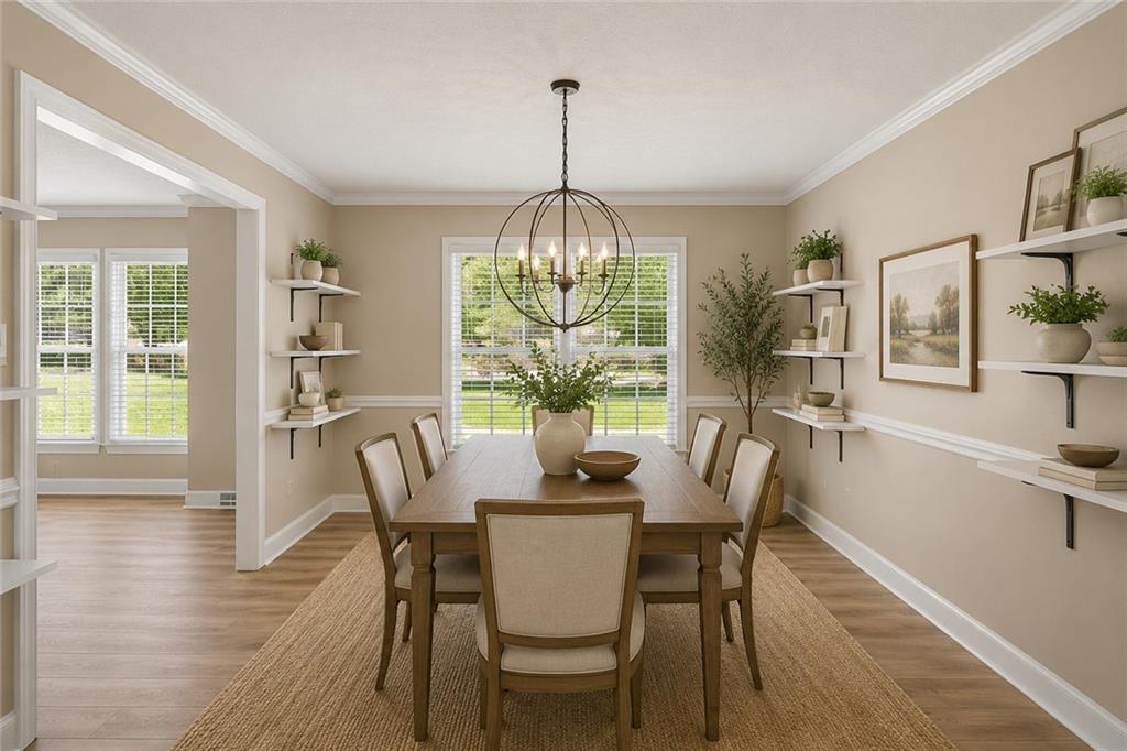 264 Bellemont Drive Southwest Rome, GA 30165 - Photo 7 of 37 a dining room with furniture a chandelier and wooden floor