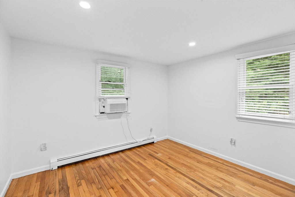 216 Poponessett Road Barnstable, MA 02635 - Photo 14 of 27 wooden floor in an empty room with a window