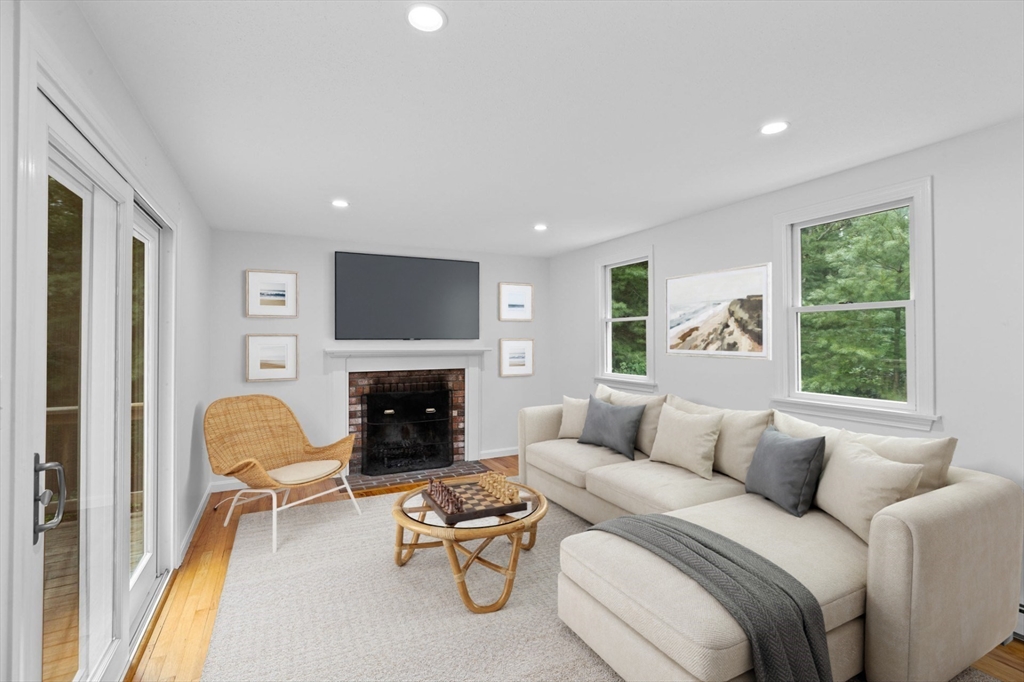 216 Poponessett Road Barnstable, MA 02635 - Photo 3 of 27 a living room with furniture fireplace and a fireplace