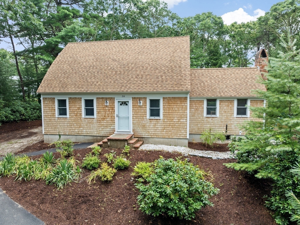 216 Poponessett Road Barnstable, MA 02635 - Photo 7 of 27 a view of a house with yard and garden