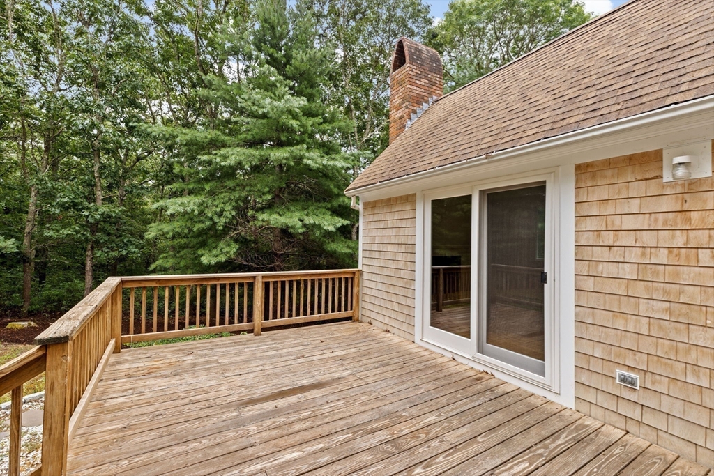216 Poponessett Road Barnstable, MA 02635 - Photo 10 of 27 a porch with seating space