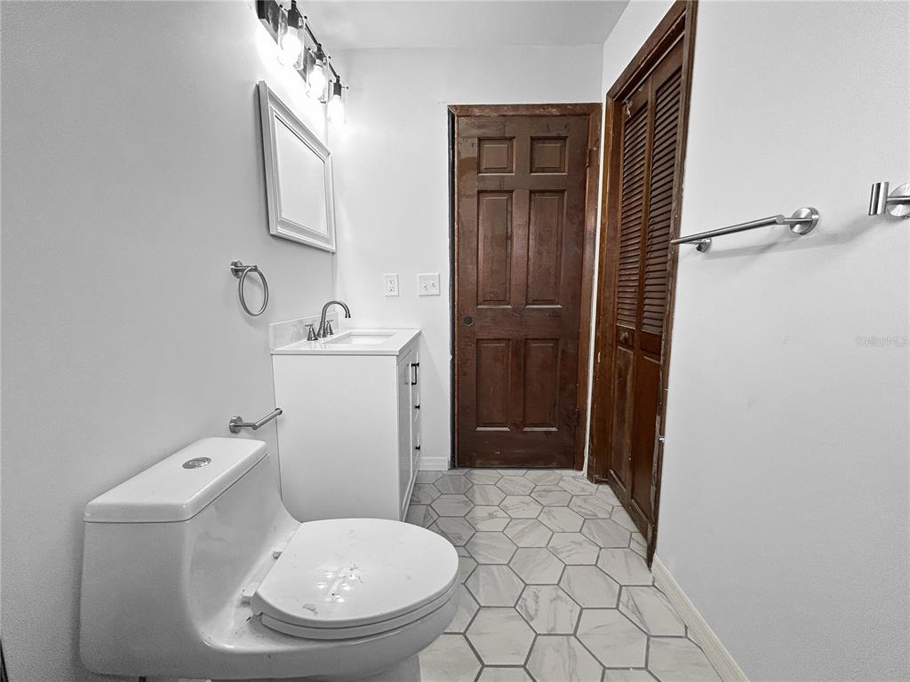4545 Debbie Lane Lutz, FL 33559 - Photo 19 of 25 a bathroom with a sink toilet and shower