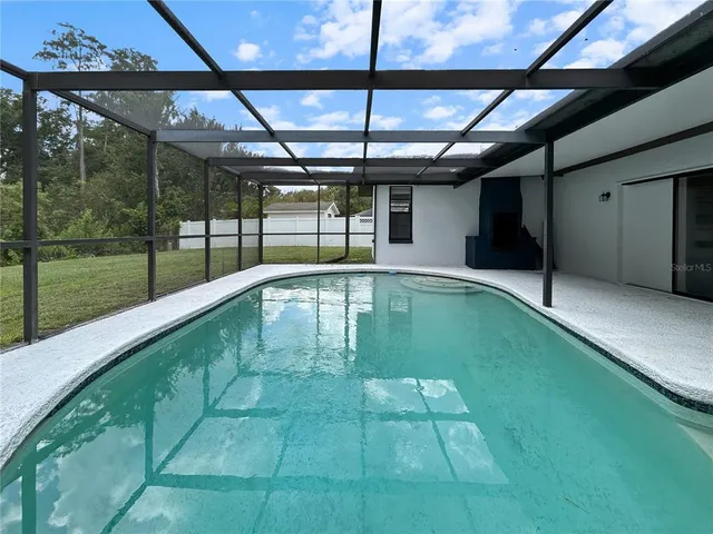 a swimming pool with a yard