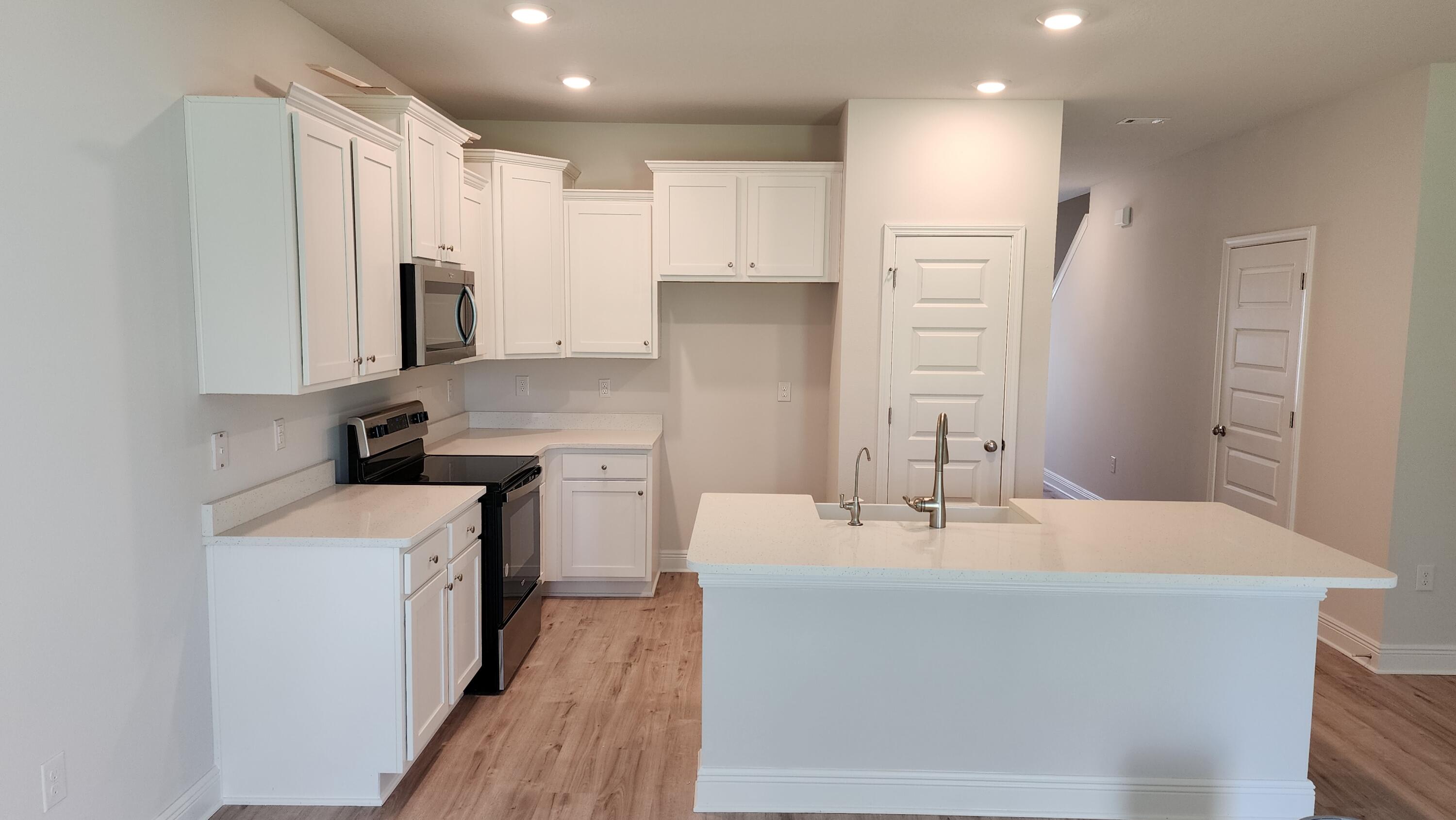 4 Renea Cove Destin, FL 32541 - Photo 2 of 12 a kitchen with stainless steel appliances a sink stove and refrigerator
