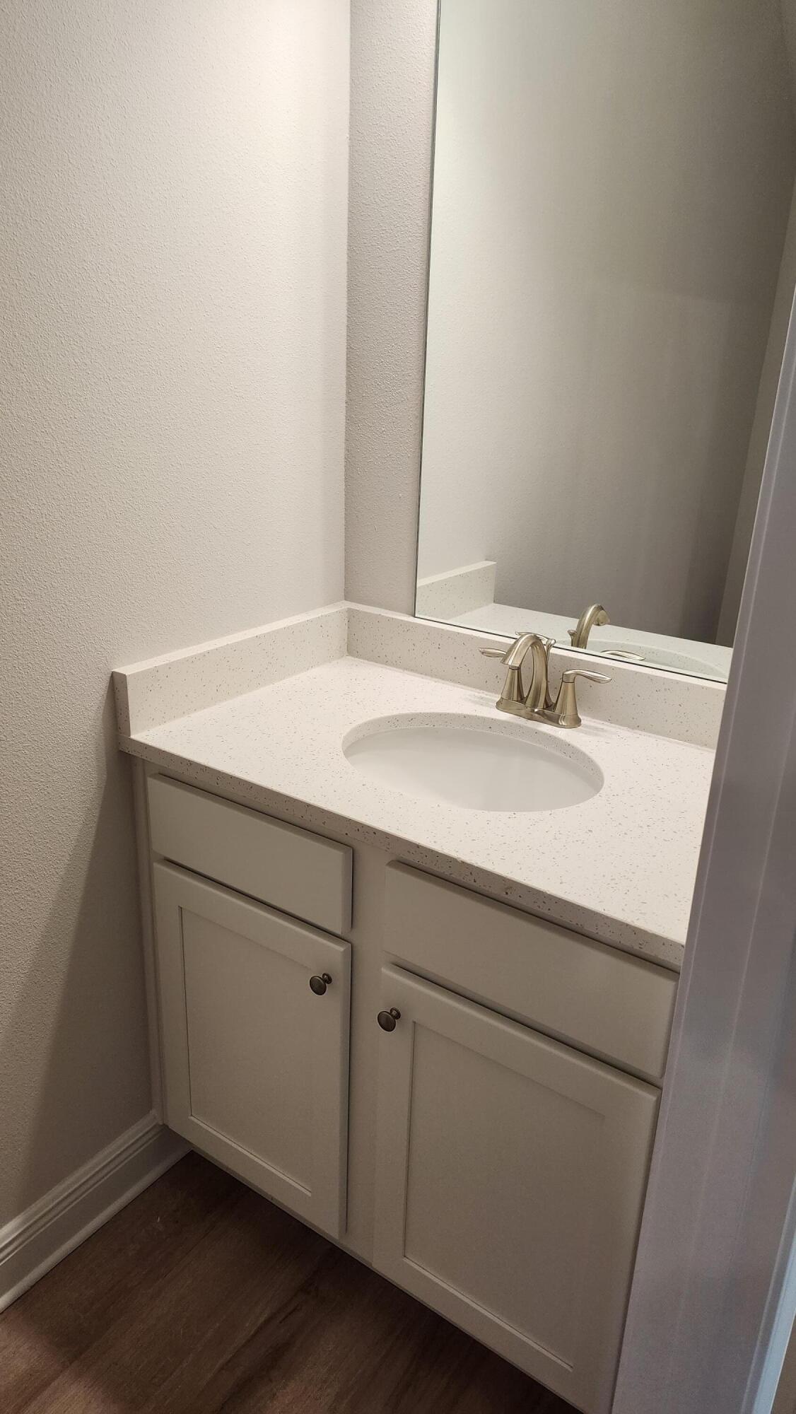 4 Renea Cove Destin, FL 32541 - Photo 5 of 12 a bathroom with a sink and a mirror