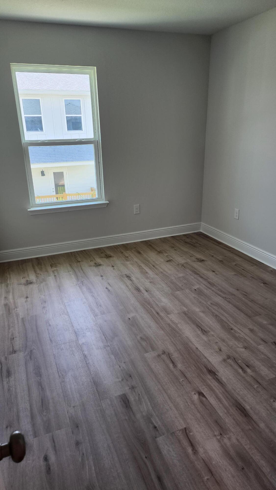 4 Renea Cove Destin, FL 32541 - Photo 10 of 12 a view of a small space with wooden floor and a window