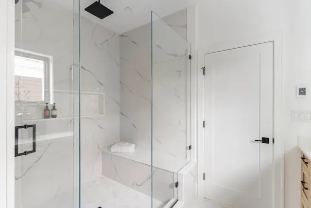 a bathroom with a shower and toilet