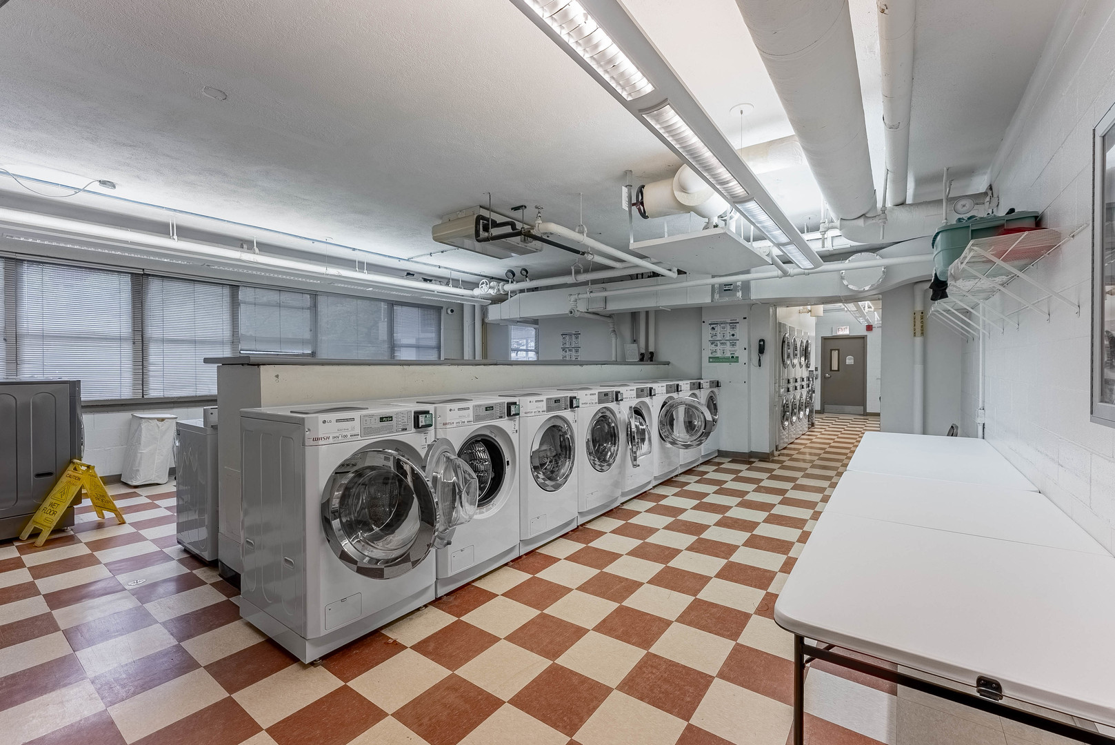 6301 North Sheridan Road, Unit 7F Chicago, IL 60660 - Photo 13 of 15 a view of a hallway with washer and dryer