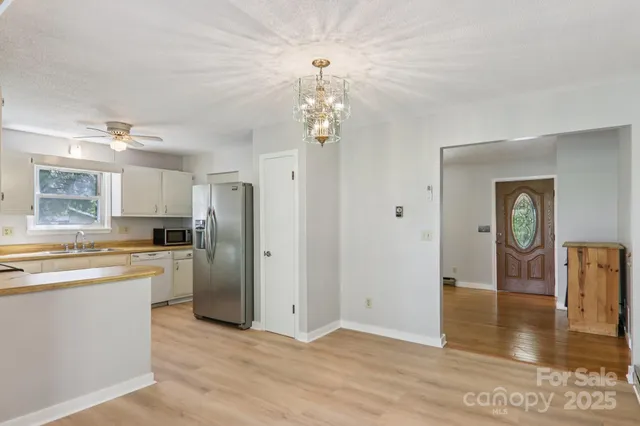 a view of a kitchen cabinets and wooden floor