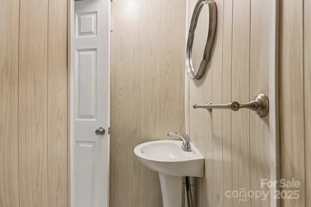 a bathroom with a sink a mirror and vanity