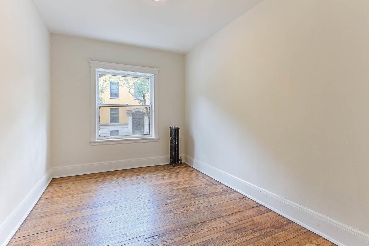601 West Fullerton Avenue, Unit 1 Chicago, IL 60614 - Photo 20 of 25 a view of an empty room with wooden floor and a window