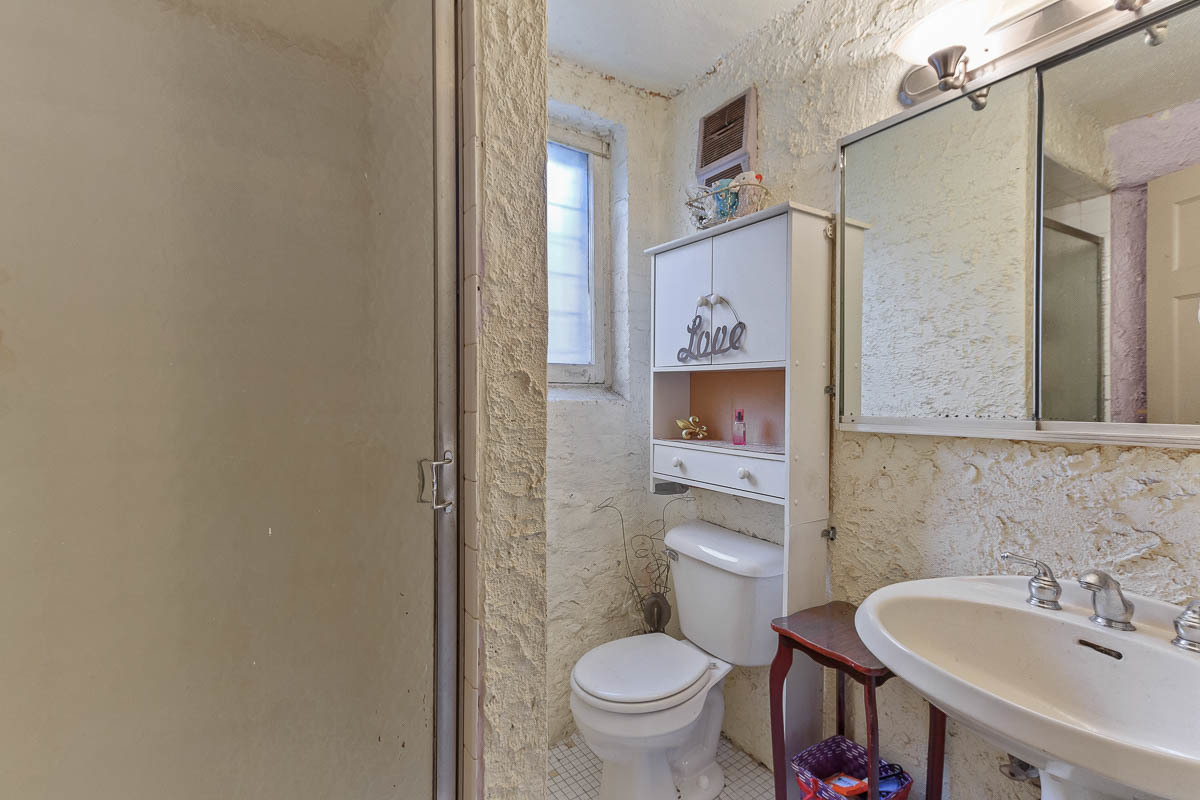 601 West Fullerton Avenue, Unit 1 Chicago, IL 60614 - Photo 24 of 25 a bathroom with a toilet sink and mirror