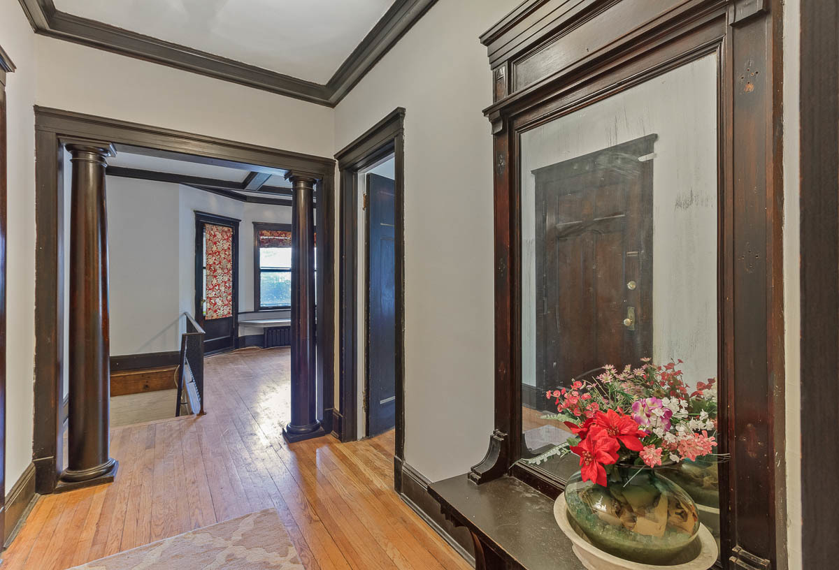 601 West Fullerton Avenue, Unit 1 Chicago, IL 60614 - Photo 3 of 25 a view of a hallway with wooden floor and a potted plant