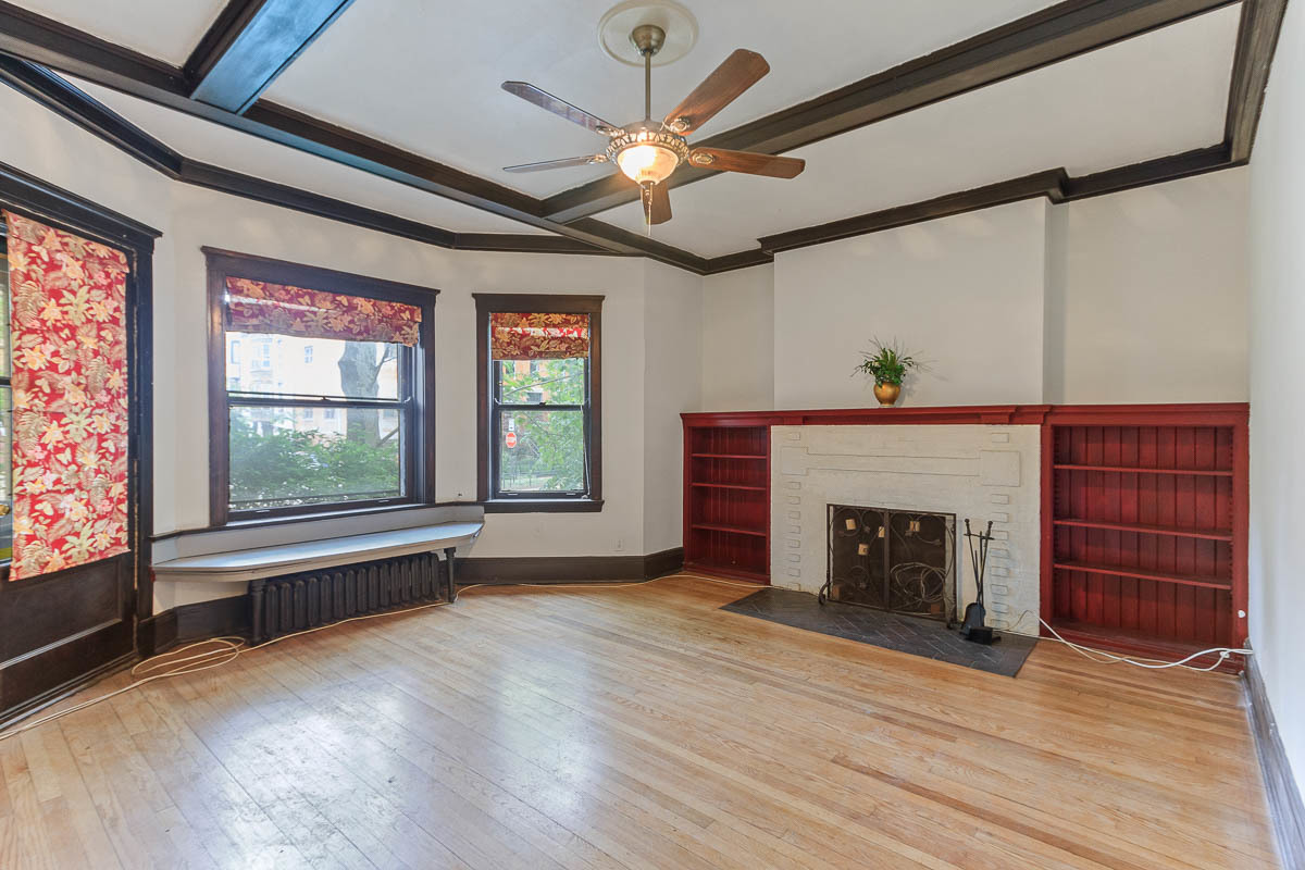 601 West Fullerton Avenue, Unit 1 Chicago, IL 60614 - Photo 4 of 25 wooden floor fireplace and windows in an empty room