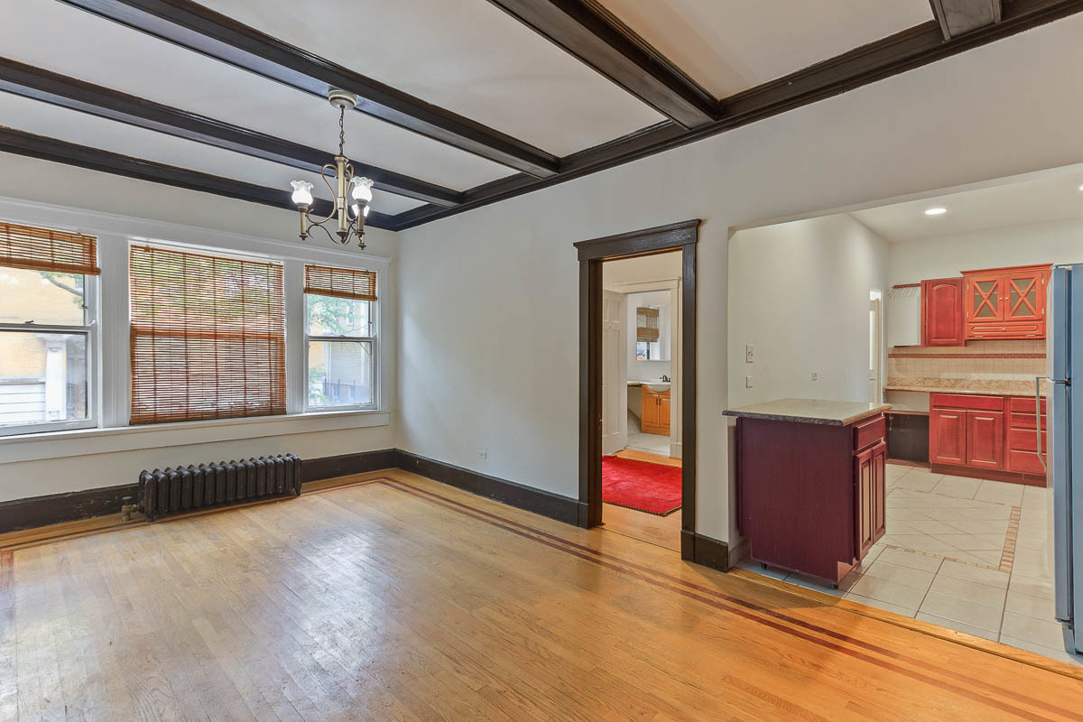 601 West Fullerton Avenue, Unit 1 Chicago, IL 60614 - Photo 9 of 25 a view of an empty room with wooden floor and windows