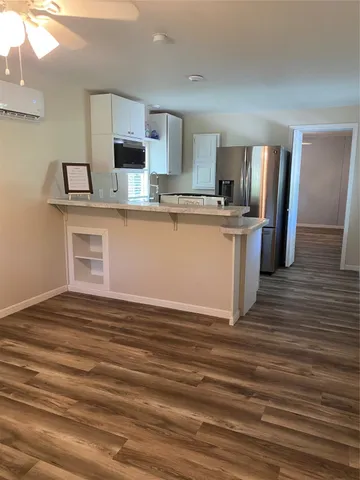 a view of a kitchen from the hallway