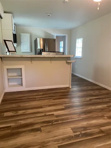 a kitchen with stainless steel appliances a refrigerator sink and stove