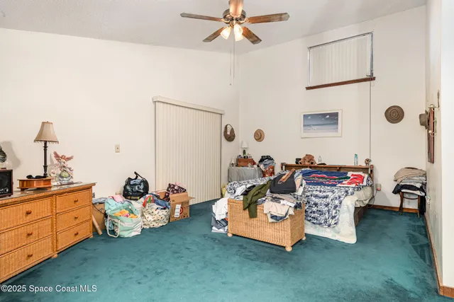 a bed room with furniture and a window