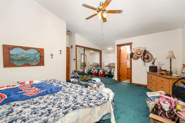 a bedroom with bed and furniture