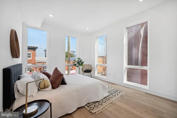 a bedroom with furniture and a window