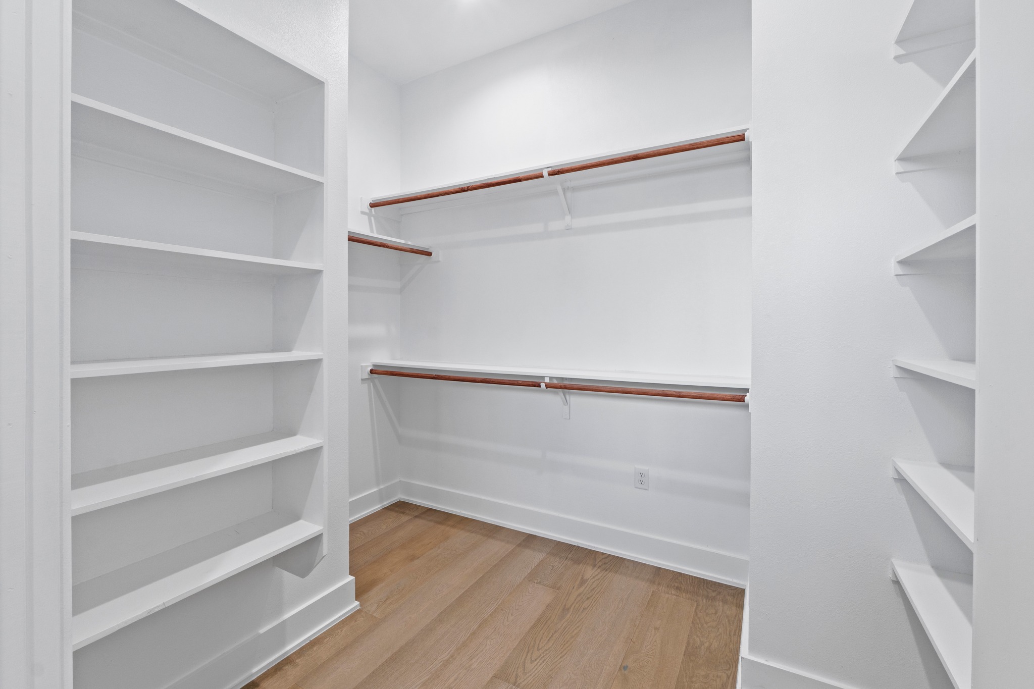 2007 Chestnut Avenue, Unit 1 Austin, TX 78722 - Photo 24 of 32 Ample shelving and hanging space defines this organized, ready-to-use closet.