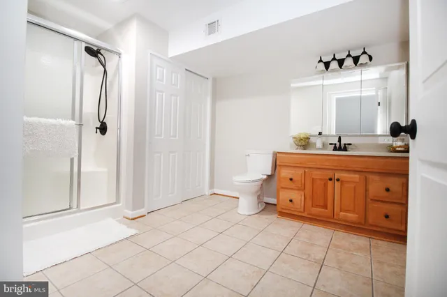 a bathroom with a sink vanity and mirror
