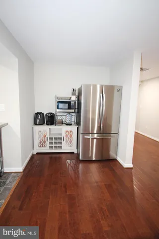 a kitchen with stainless steel appliances a refrigerator and a stove