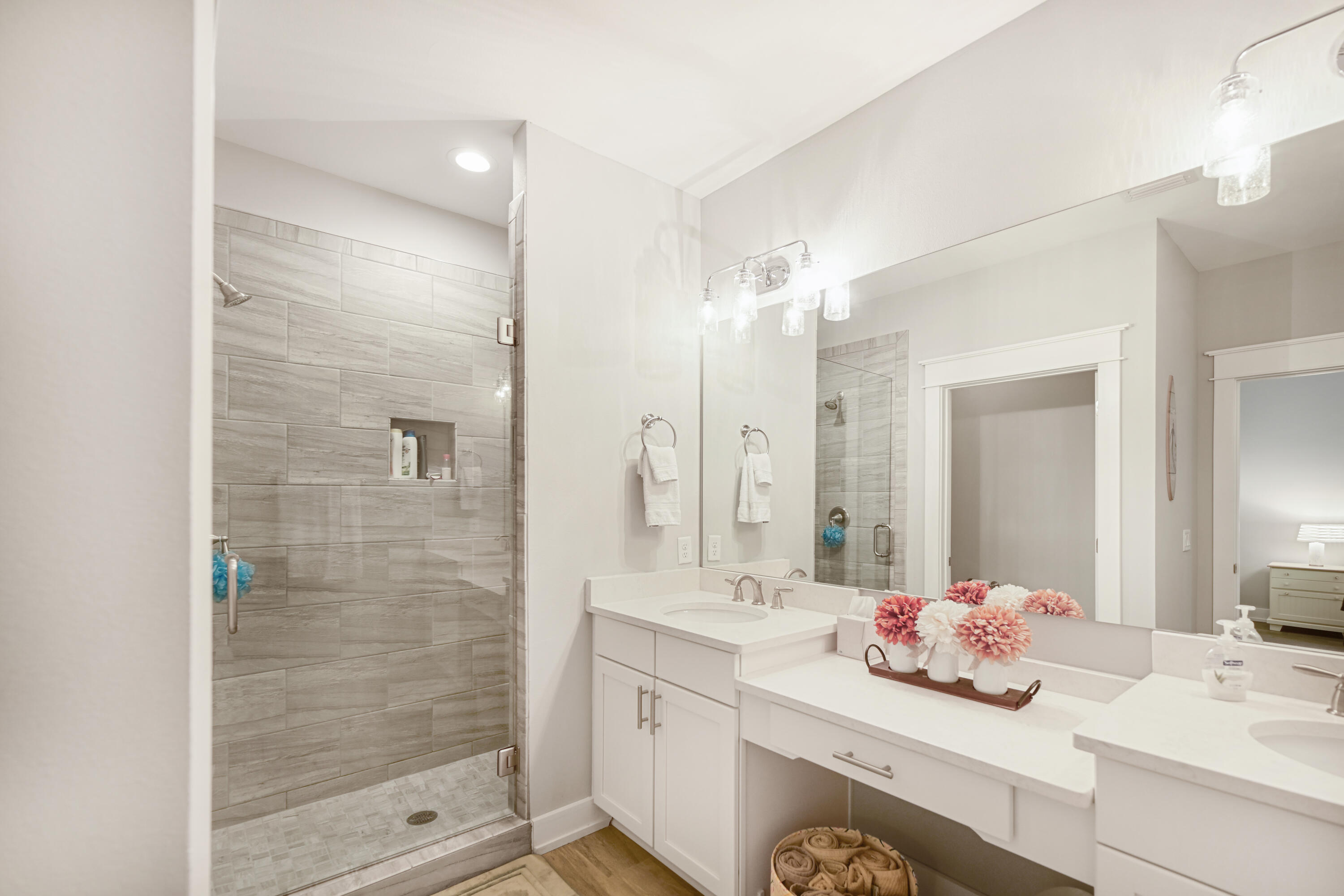 31 West Willow Mist Road Inlet Beach, FL 32461 - Photo 18 of 43 a bathroom with a double vanity sink mirror and shower