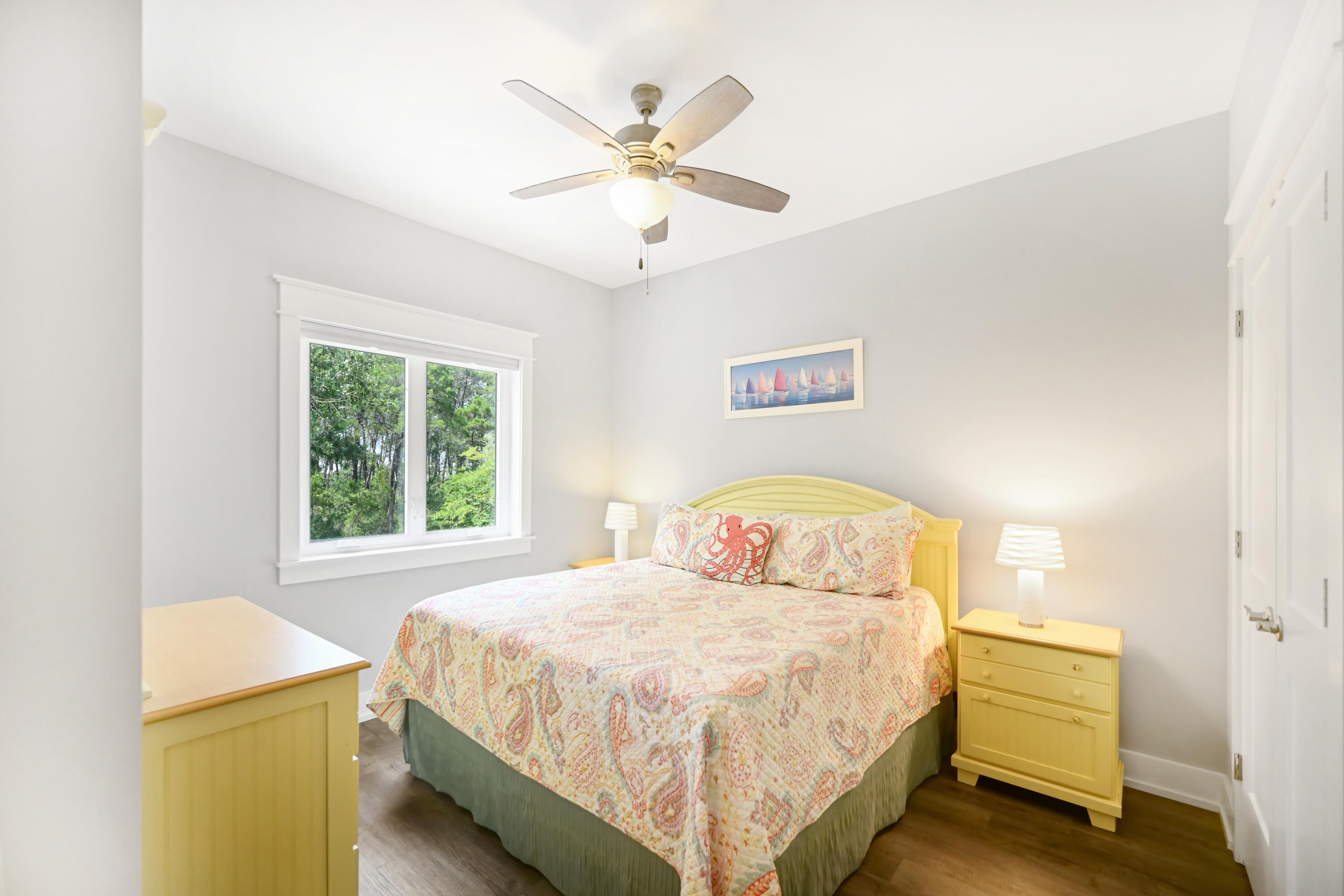 31 West Willow Mist Road Inlet Beach, FL 32461 - Photo 19 of 43 a bedroom with a bed and a chandelier