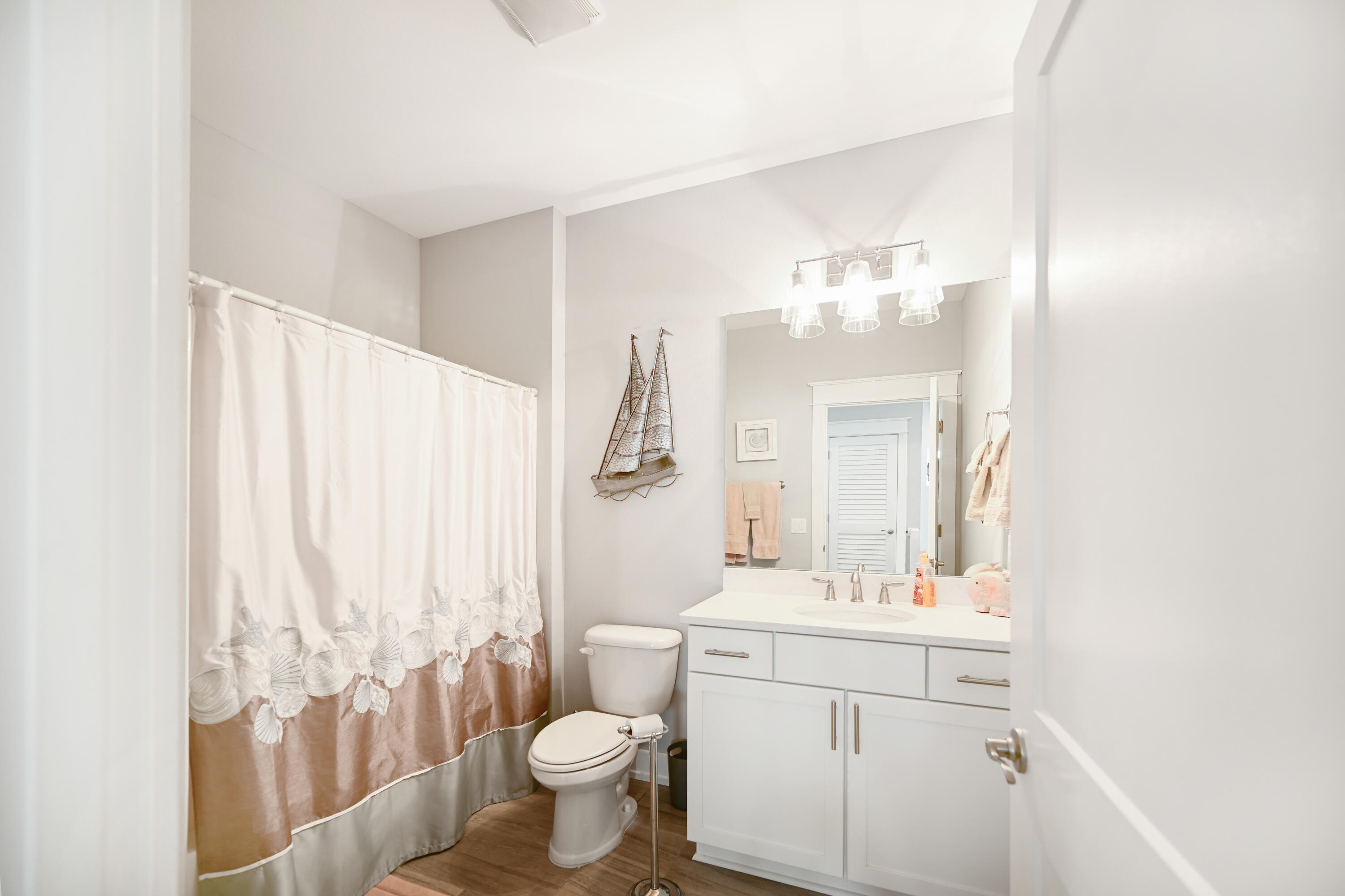 31 West Willow Mist Road Inlet Beach, FL 32461 - Photo 20 of 43 a bathroom with a sink toilet a mirror and vanity