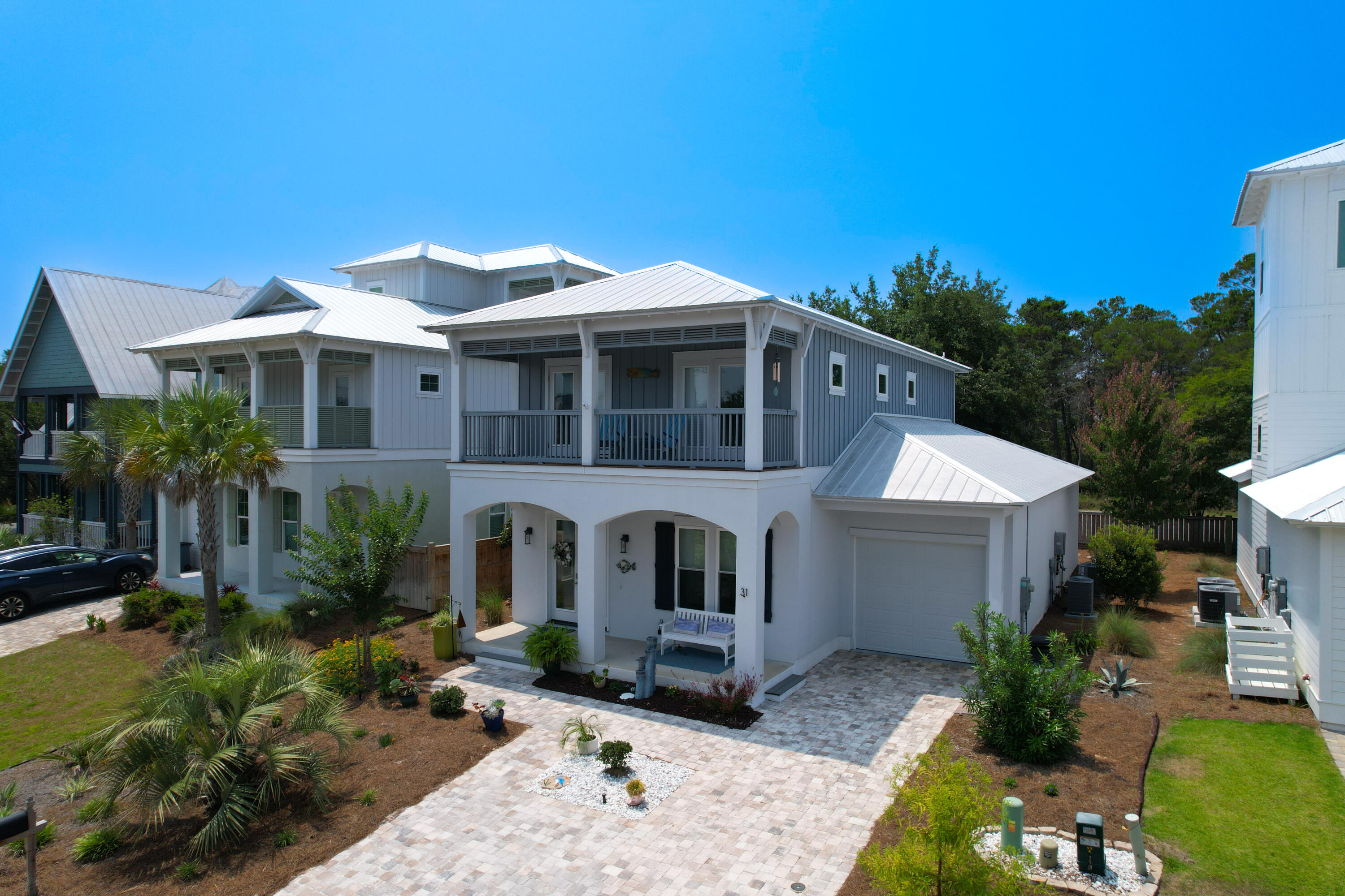 31 West Willow Mist Road Inlet Beach, FL 32461 - Photo 2 of 43 a front view of a house with garden