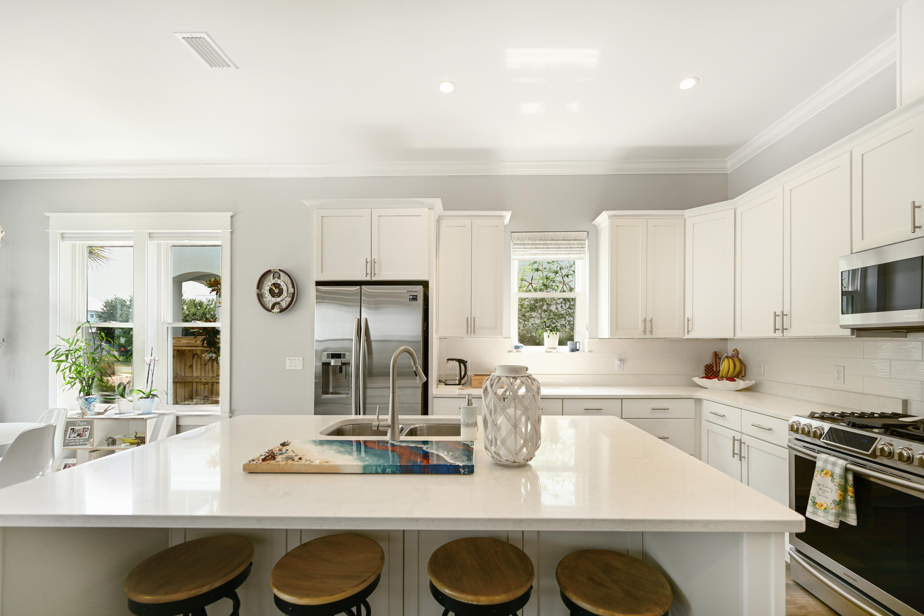 31 West Willow Mist Road Inlet Beach, FL 32461 - Photo 7 of 43 a kitchen with kitchen island granite countertop a sink cabinets and stainless steel appliances