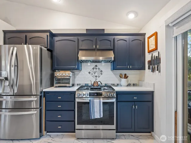a kitchen with a sink and a window