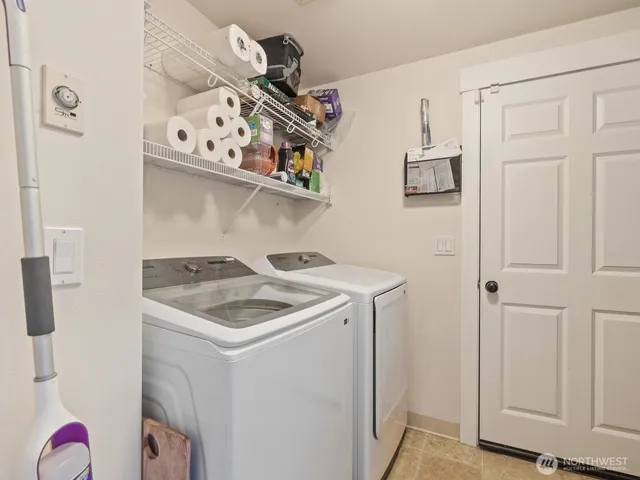 a view of a patio with iron fence