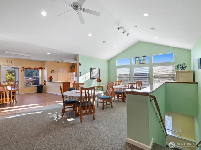 a dining room with furniture a garden view and window