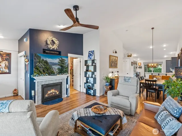 a living room with furniture and kitchen view