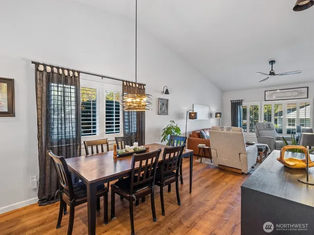a view of a dining room with furniture window and wooden floor