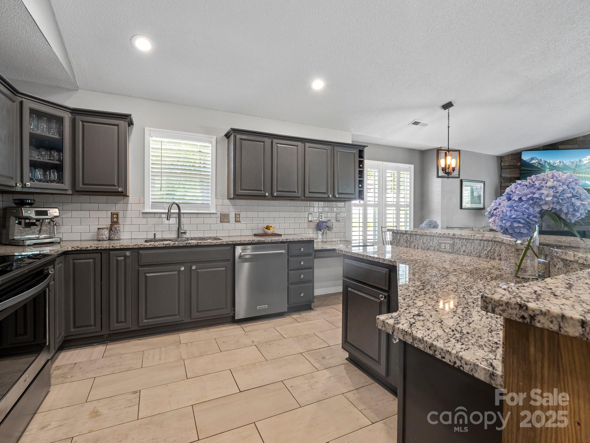 10 Gray Wolf Lane Hendersonville, NC 28792 - Photo 13 of 42 a kitchen with stainless steel appliances granite countertop a stove sink and cabinets