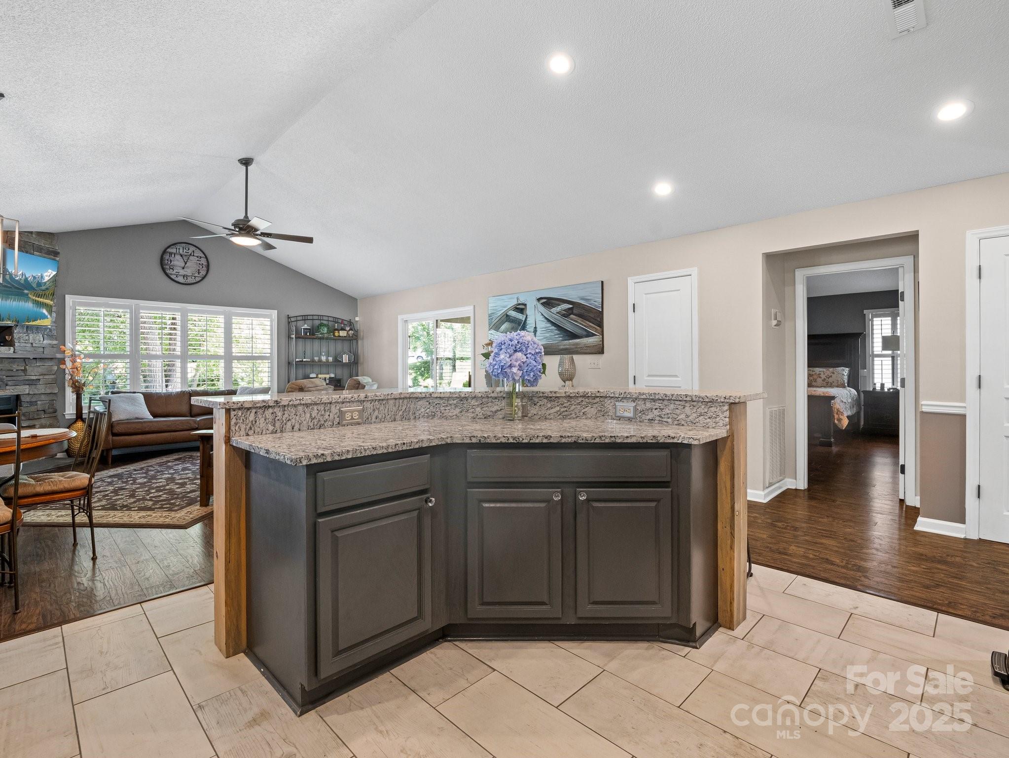 10 Gray Wolf Lane Hendersonville, NC 28792 - Photo 14 of 42 a kitchen with kitchen island granite countertop a sink and cabinets