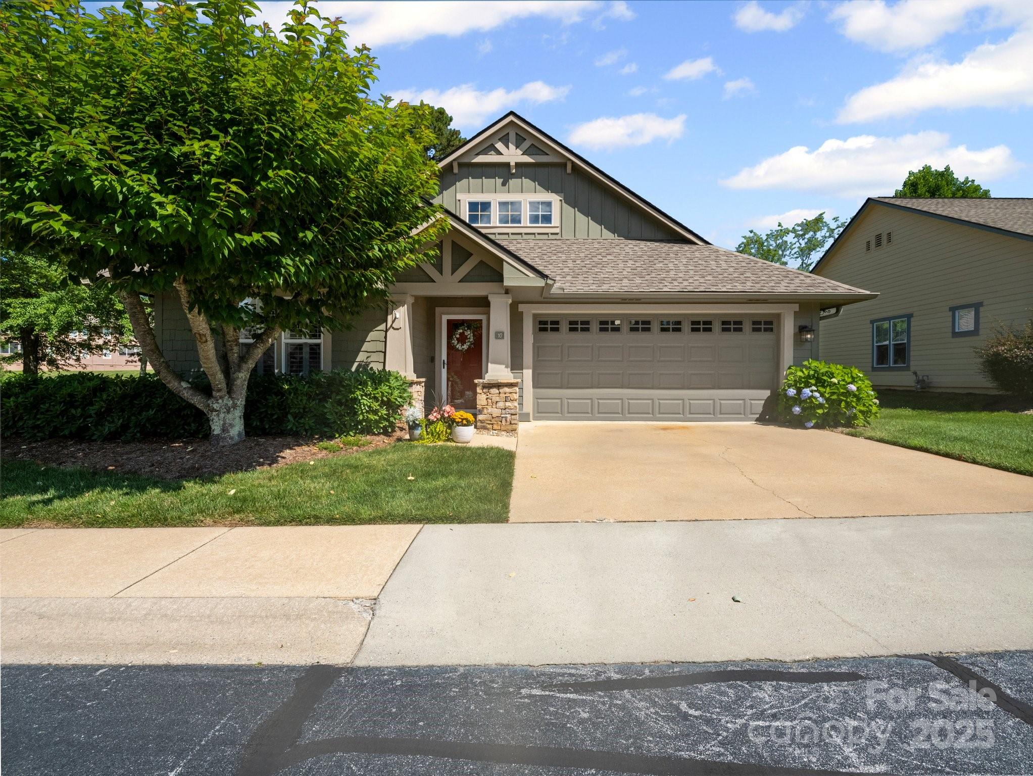 10 Gray Wolf Lane Hendersonville, NC 28792 - Photo 2 of 42 a front view of a house with a yard and garage
