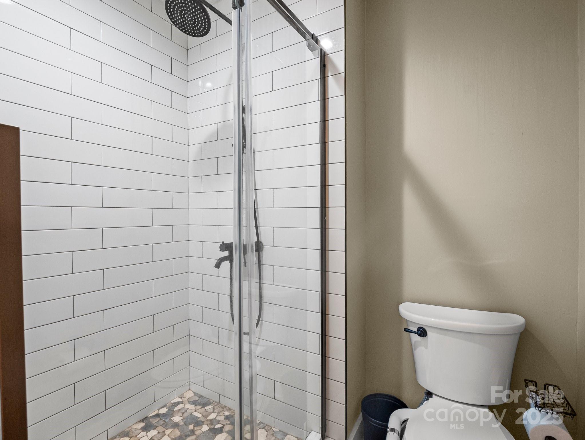 10 Gray Wolf Lane Hendersonville, NC 28792 - Photo 25 of 42 a bathroom with a toilet and shower