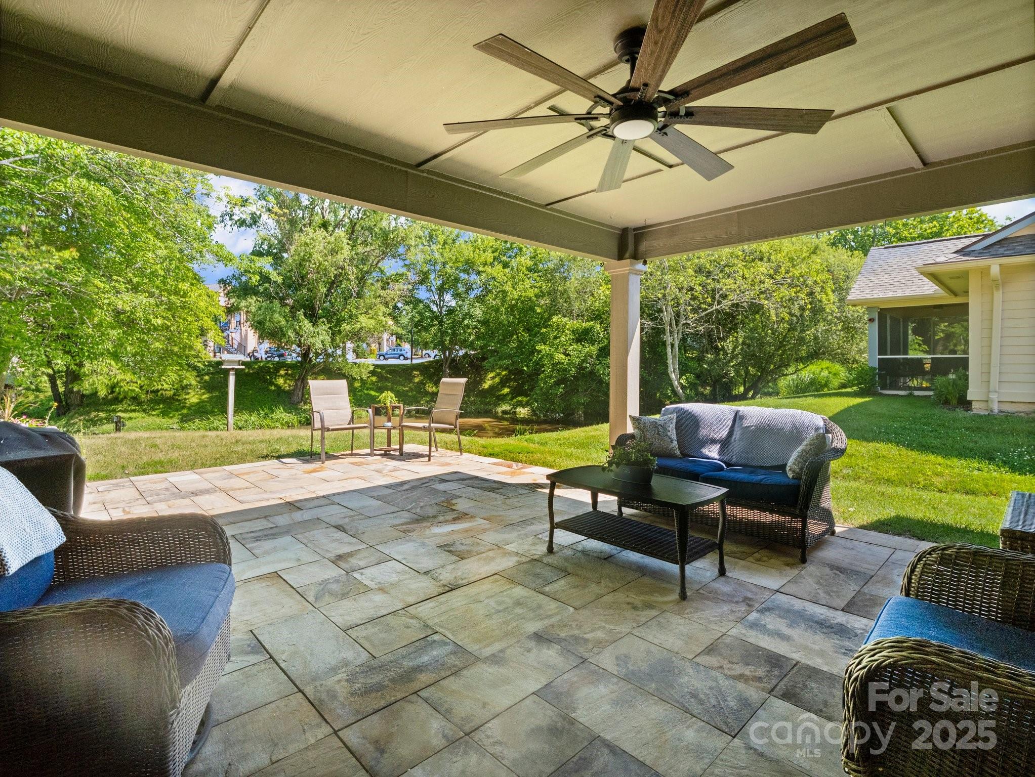 10 Gray Wolf Lane Hendersonville, NC 28792 - Photo 26 of 42 a view of a patio with a table chairs and a yard
