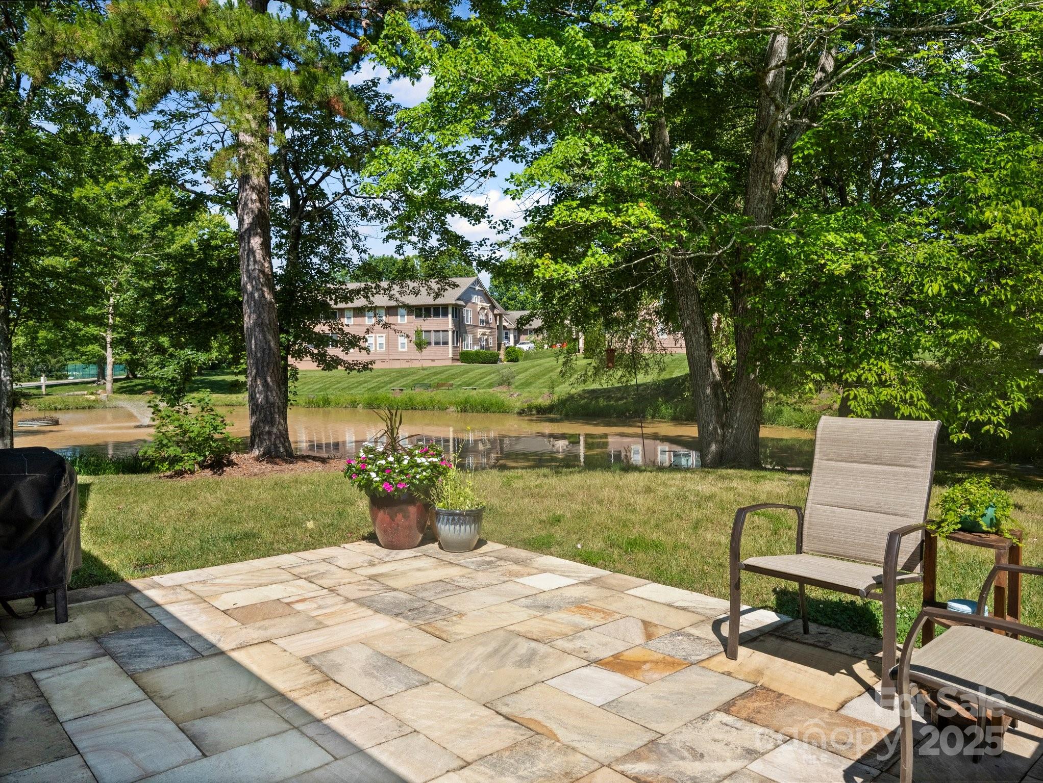 10 Gray Wolf Lane Hendersonville, NC 28792 - Photo 28 of 42 a lawn chairs and a table in a backyard