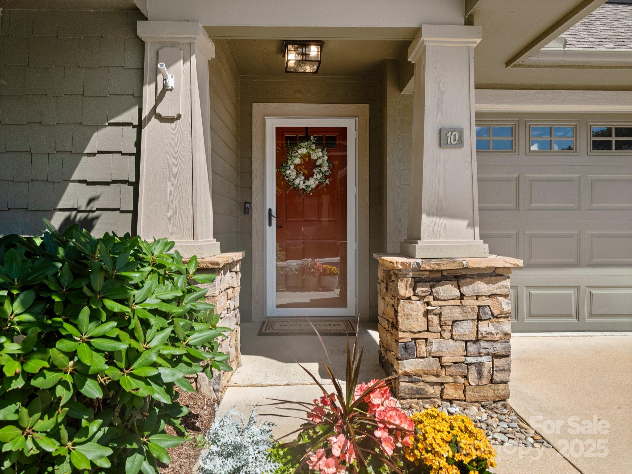 10 Gray Wolf Lane Hendersonville, NC 28792 - Photo 3 of 42 a front view of a house with a potted plant and a window