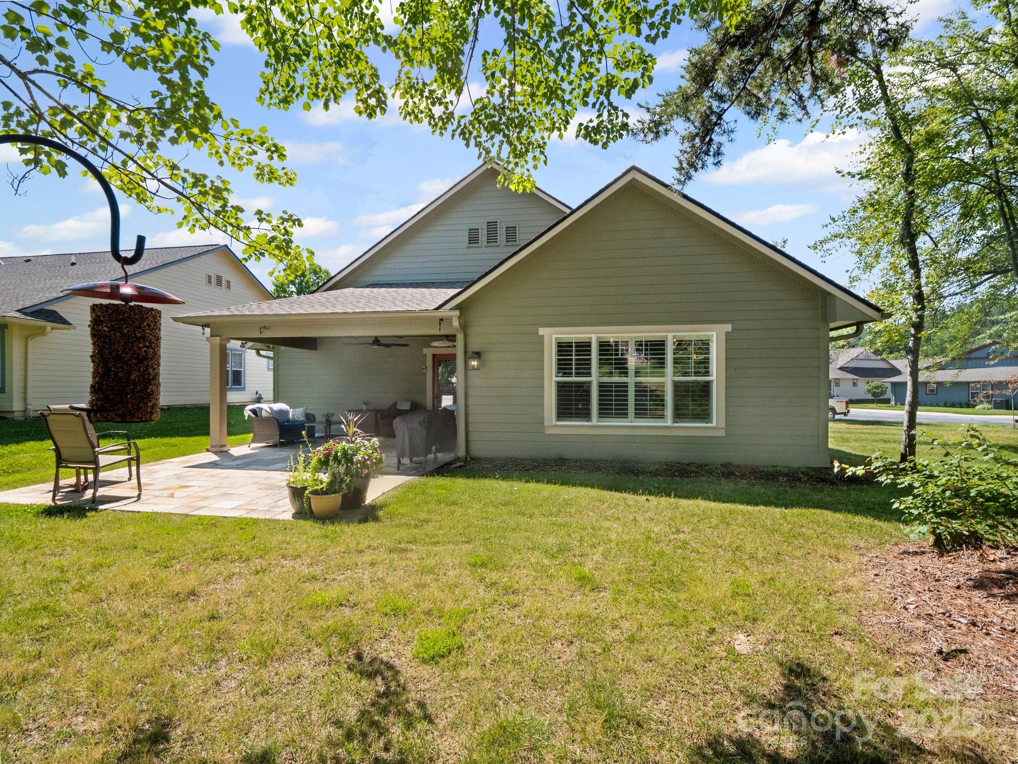 10 Gray Wolf Lane Hendersonville, NC 28792 - Photo 32 of 42 a view of a house with backyard and sitting area