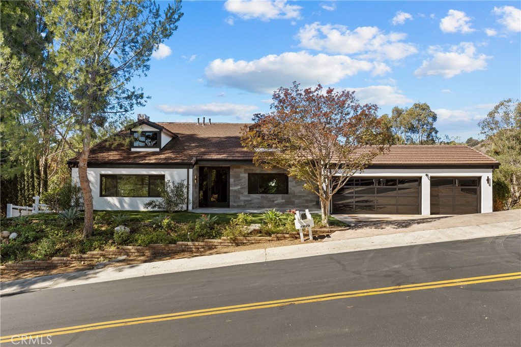 a view of a house with a street