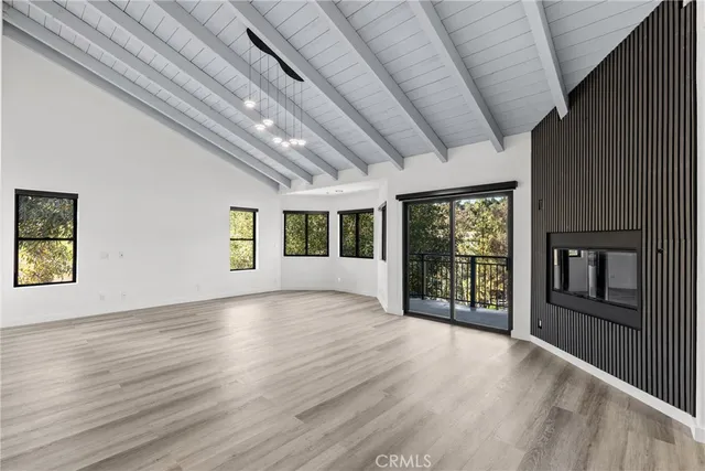 a view of a livingroom with wooden floor