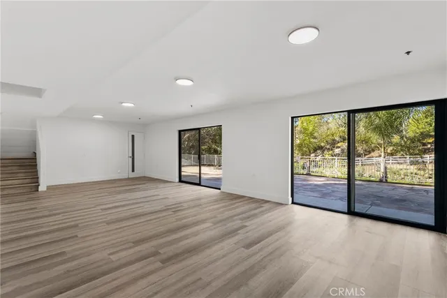 a view of a balcony with wooden floor